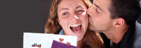 Smiling Couple with Greeting Card